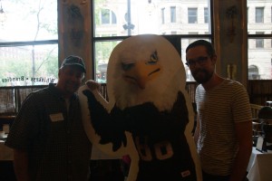 Auggies pose with Auggie Eagle stand-up figure